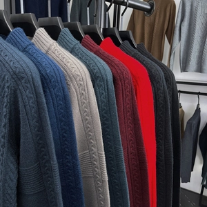 Close-up of cable knit textures showing various color options for men's sweaters