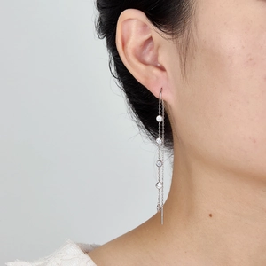 Close-up of S925 silver tassel drop earrings with sparkling round cubic zirconia stones