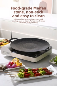 Maifan stone non-stick round grill pan with handles on a portable gas stove