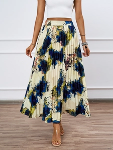 Detailed view of abstract oil painting print and fine pleats on an A-line skirt