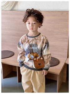 Kids brown NASA bear sweatshirt styled with a cute bear crossbody bag and khaki trousers