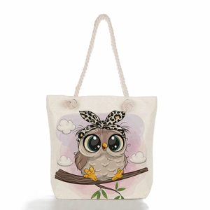 Detailed close-up of heavy-duty canvas tote bag featuring cute cartoon owl print detail