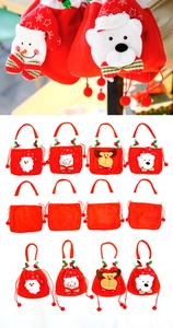 Detail of Christmas drawstring gift bags with plush Santa, Snowman, Reindeer, and Bear