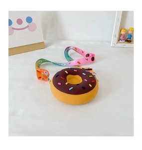 Detailed macro view of chocolate-themed donut silicone mini crossbody bag with rainbow strap