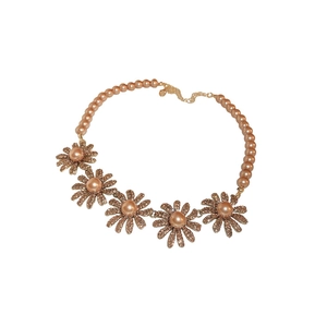 Rose gold daisy necklace with faux pearls and crystal petals on a white background