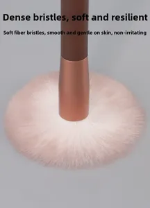 Close-up of soft fiber makeup brush bristles showing density and gradient pink color