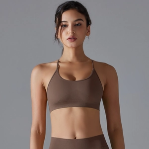 Close-up of seamless brown yoga bra and leggings with ribbed texture and back design