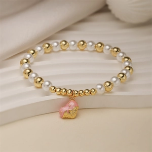 Pink heart donut pendant beaded bracelet with white pearls and gold metal accents