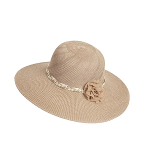 Detail view of khaki straw sun hat featuring a delicate chiffon flower and woven texture