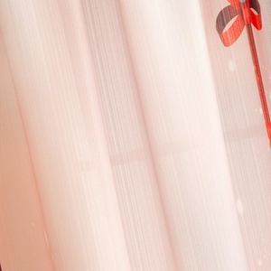 Detailed macro view of pink Christmas mesh curtain with delicate pearls and vertical texture