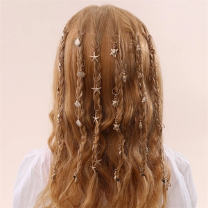 Golden sea-themed braid rings with starfish and turtle charms on model's hair