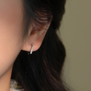 Elegant S925 sterling silver C-shaped hoop earrings featuring shimmering zircon stones