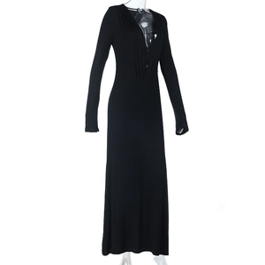 Close-up of black V-neck maxi dress with long sleeves and elegant button detailing