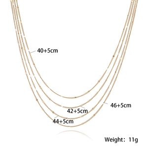 Detailed view of layered 18k gold plated stainless steel necklace with size and weight info