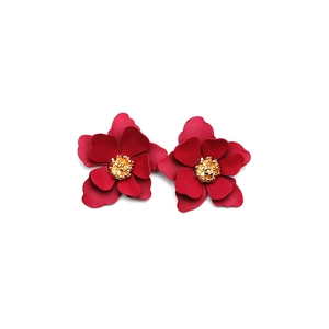 Elegant multi-layered red flower stud earrings with a golden stamen and matte finish