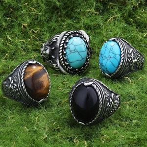 Detailed eagle relief carving and gemstone inlay on men's vintage stainless steel rings