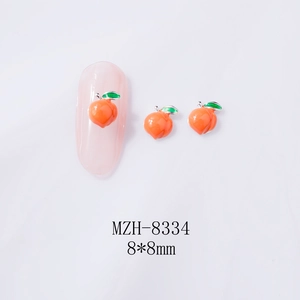 Detail of peach-shaped alloy nail charms with green leaves on 8x8mm size