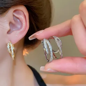 U-shaped 18k gold plated hoop earrings with zircon pavé in gold and silver finish