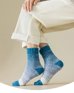 Close-up of thick blue gradient coral fleece sleep socks with soft terry texture