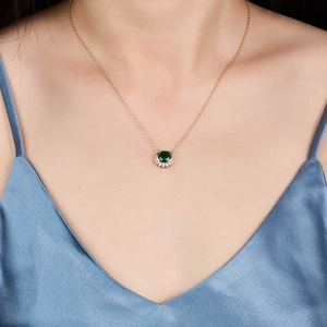 925 sterling silver necklace with vintage green zircon pendant on a gold chain