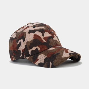 Detail view of woodland camouflage corduroy fabric on a six-panel baseball cap