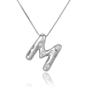 Macro shot of silver letter M necklace pendant with white zircon stones and box chain
