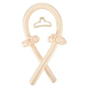 Detail shot of champagne silk heatless hair curler set with two scrunchies and a claw clip