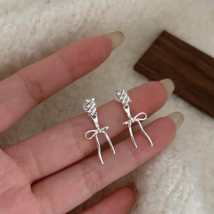 Minimalist 925 sterling silver bow knot stud earrings with polished metallic finish