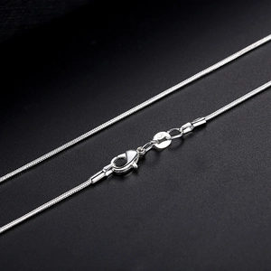 1mm silver plated snake chain necklace with lobster clasp on a black background