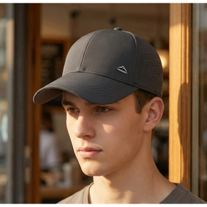 Detail view of charcoal gray mesh baseball cap with laser-cut side ventilation holes