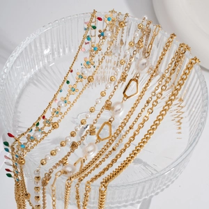 Double-layered stainless steel anklet with gold chains and pearl accents for women
