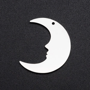 Detailed view of silver crescent moon face charm pendant with hole for DIY jewelry making