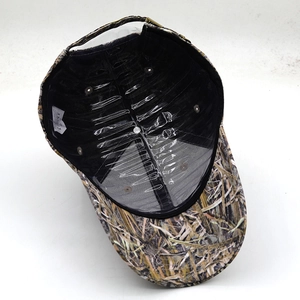 Detail of camouflage baseball cap showing internal structure with support and metal buckle