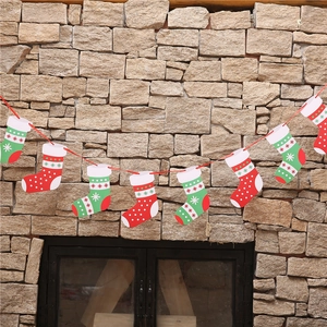 Detail of Christmas paper bunting featuring red and green socks with snowflake patterns