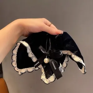 Velvet hair scrunchie with lace trim, satin 'CHANGE' ribbon and a pearl pendant