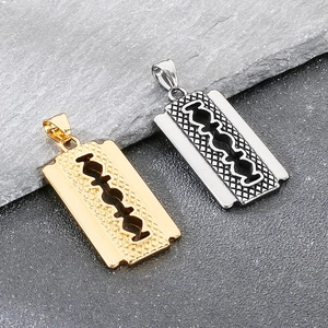 Detail of silver and gold razor blade pendants with mesh texture and industrial punk style