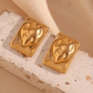 Detail of 18K gold plated rectangular earrings with monstera leaf relief on stone