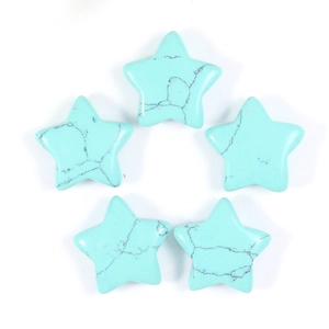 Macro view of five turquoise star-shaped stones with natural black vein patterns