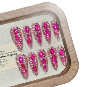 Sparkly dragon fruit pink rhinestone handmade press-on nails in long stiletto shape