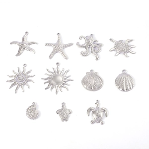 Detail view of 11 silver ocean-themed metal pendants including starfish and shells