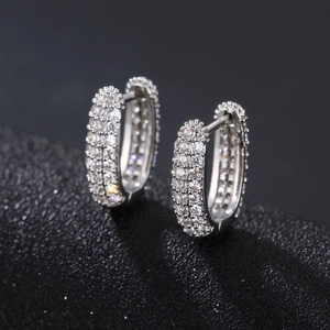 Silver-toned oval hoop earrings with triple-row micro-set white zircon stones