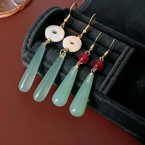New Chinese style drop earrings with resin beads and green stones on velvet