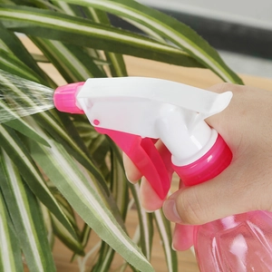 Pink manual garden spray bottle for watering indoor plants with fine mist nozzle