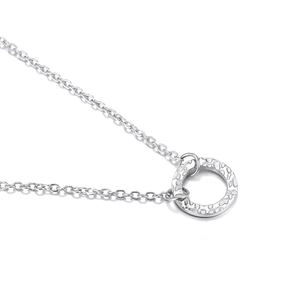 Minimalist silver hammer-textured circle pendant necklace with fine link chain on white