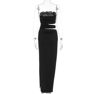 Detail of sexy black bodycon dress featuring waist cut-out and ruched elastic fabric