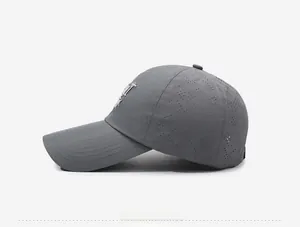Detail view of breathable laser-cut vents and embroidery on grey quick-dry baseball cap