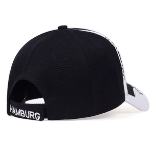 Detail of adjustable back strap and white Hamburg embroidery on a cotton baseball cap