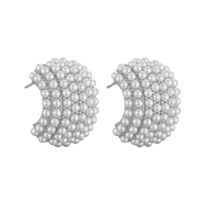 Detail of C-shaped drop earrings featuring white micro pearls on silver metal base