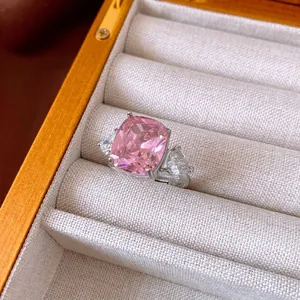 Elegant cushion cut pink zircon open ring with triangular side stones in silver setting