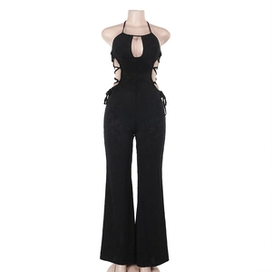 Detail of black halter neck jumpsuit with side waist cut-out and lace-up design